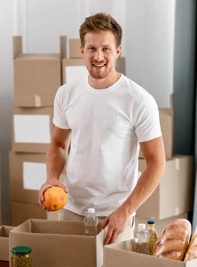 Volunteer preparing food donations